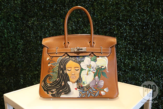 Heart and her hand-painted Hermes bag at Milan Fashion week