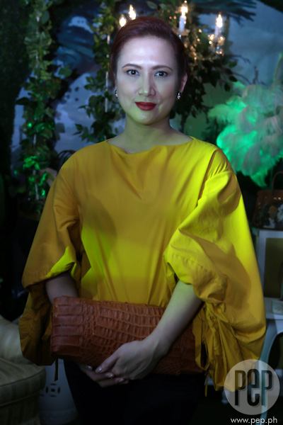 Heart Evangelista proudly wears one of her handpainted Hermes bags