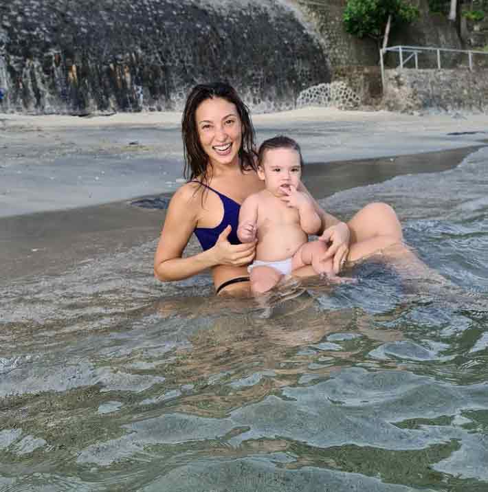 Solenn and baby Tili at a beach