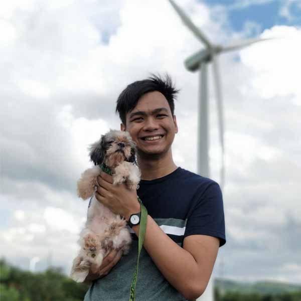 Sirven Carandang Garibay holding a dog