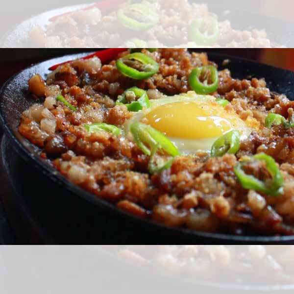 Sisig topped with raw egg
