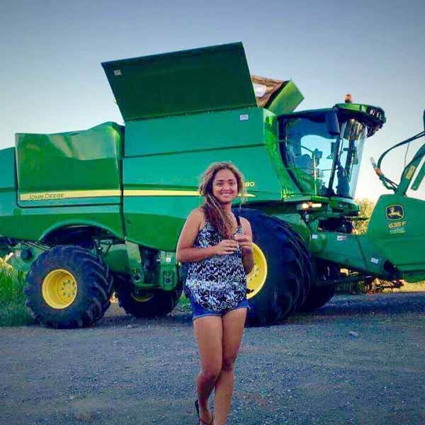 Leizel Alegre with green tractor at the background