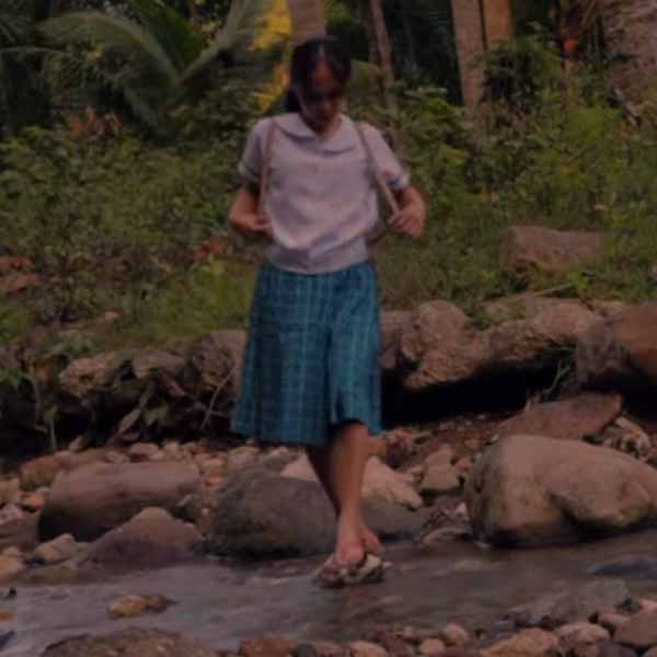 A GNHS student crossing the river