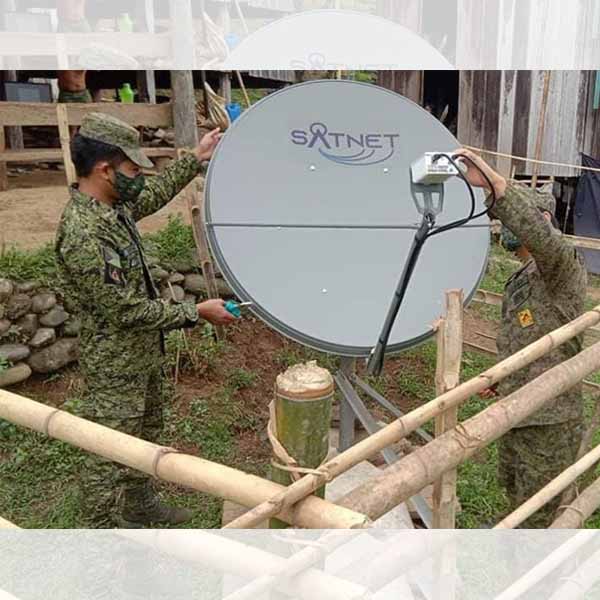 Army personnel installing VSAT