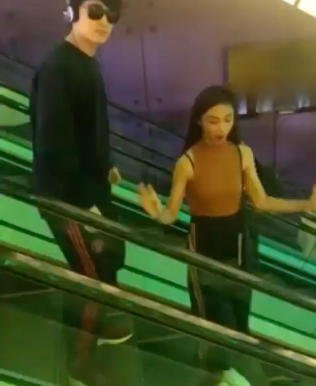 Maymay Entrata and Edward Barber dancing in an escalator