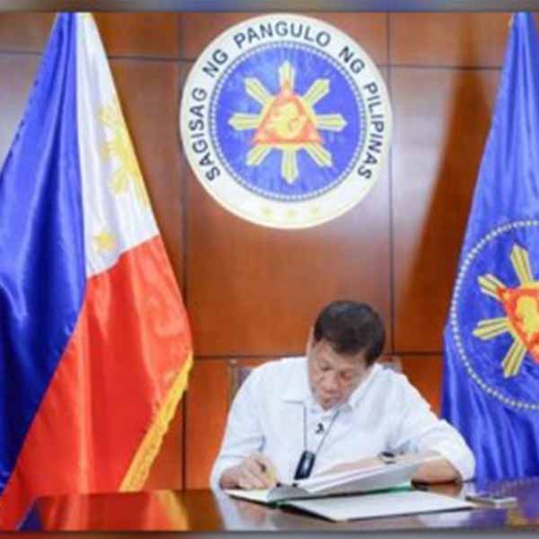 President Rodrigo Duterte signing.