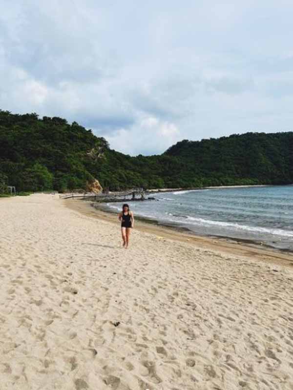 Cassy Legaspi walking in the sand