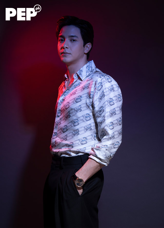Alden Richards is wearing a Fendi silk button-down shirt and shorts, and Carolina Herrera sneakers.