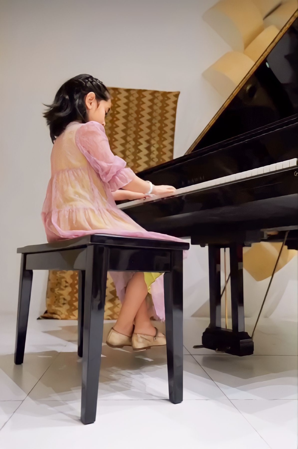 Scarlet Snow Belo plays at her first-ever piano recital.