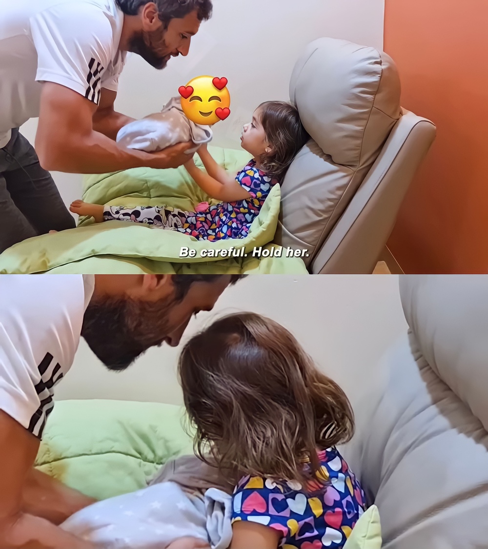 Nico Bolzico lets daughter Tili hold her baby sister