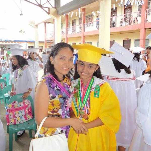 High school graduation photo of Roslyn Vea Damasco with her mom