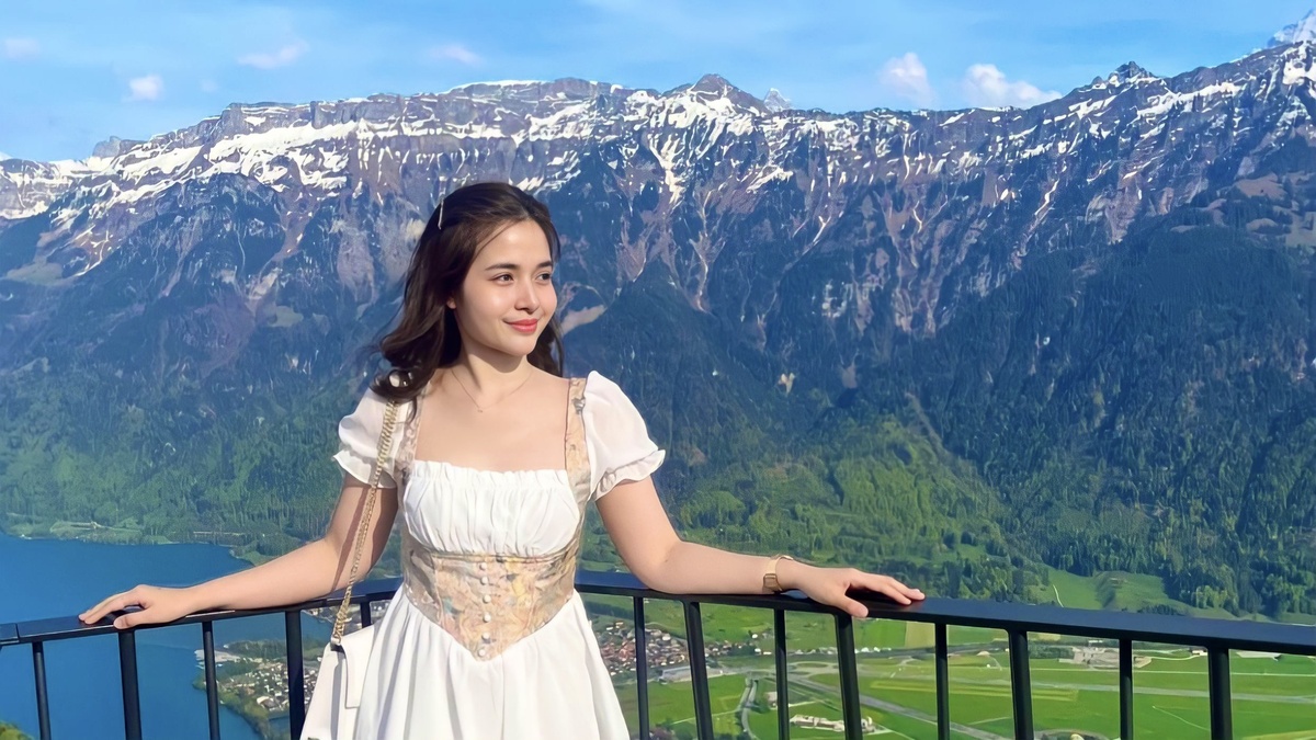 A photo of Kristel Fulgar with a scenic background behind her.