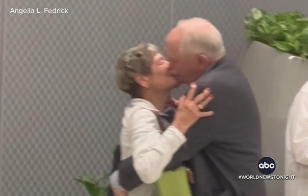 kiss of old couple