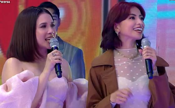 Karylle and Glaiza de Castro holding microphones