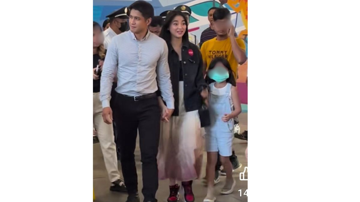 Aljur Abrenica and AJ Raval with a young girl